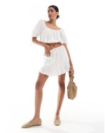 gathered crop blouse and mini skirt co ord in ivory